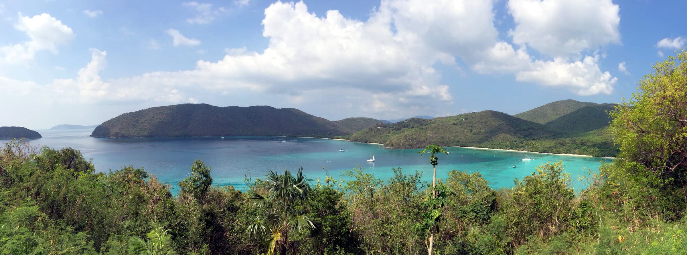 Francis Bay on St. John, its turquoise water and long sand arc framed by green headlands and anchored sailboats, photographed in 2014.