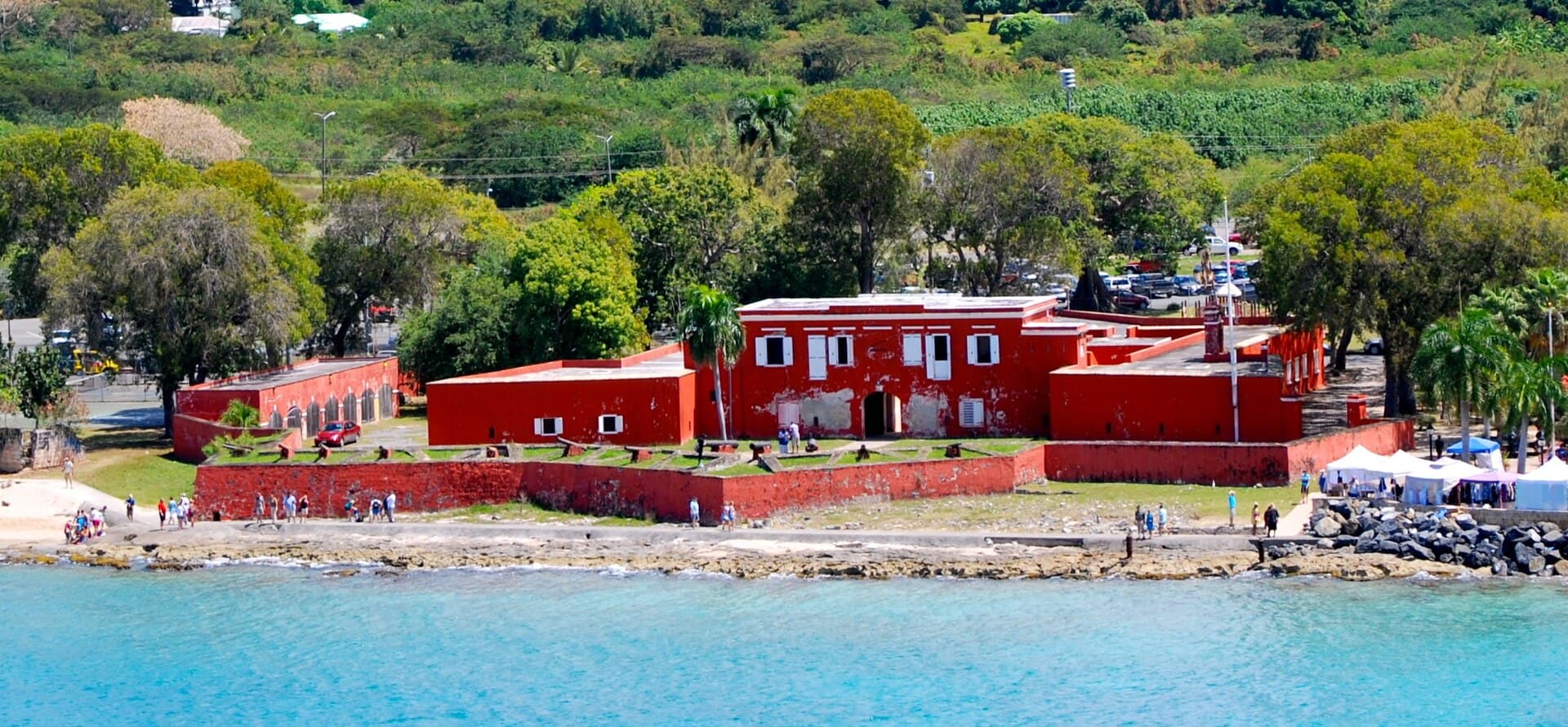 The red ramparts of Fort Frederik beside the Frederiksted shoreline on St. Croix.