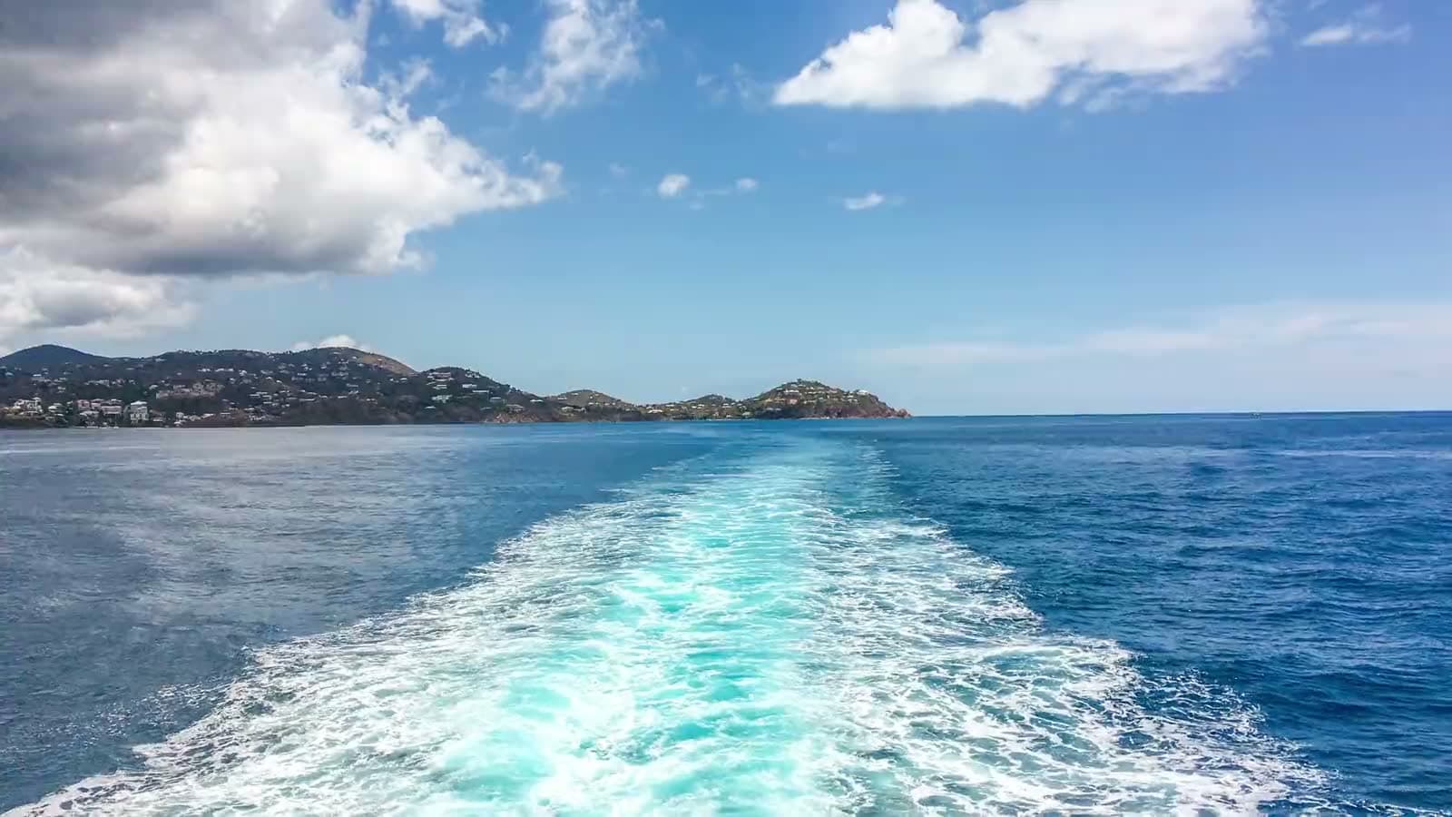 Passenger ferry crossing blue water between St. Thomas and St. John