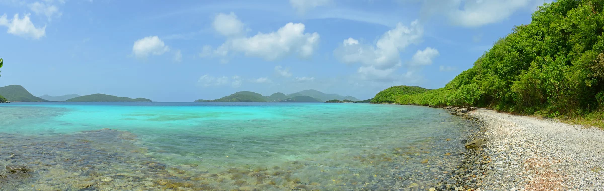 Clear shallow water and cobble shoreline along the Leinster Bay trail on St. John
