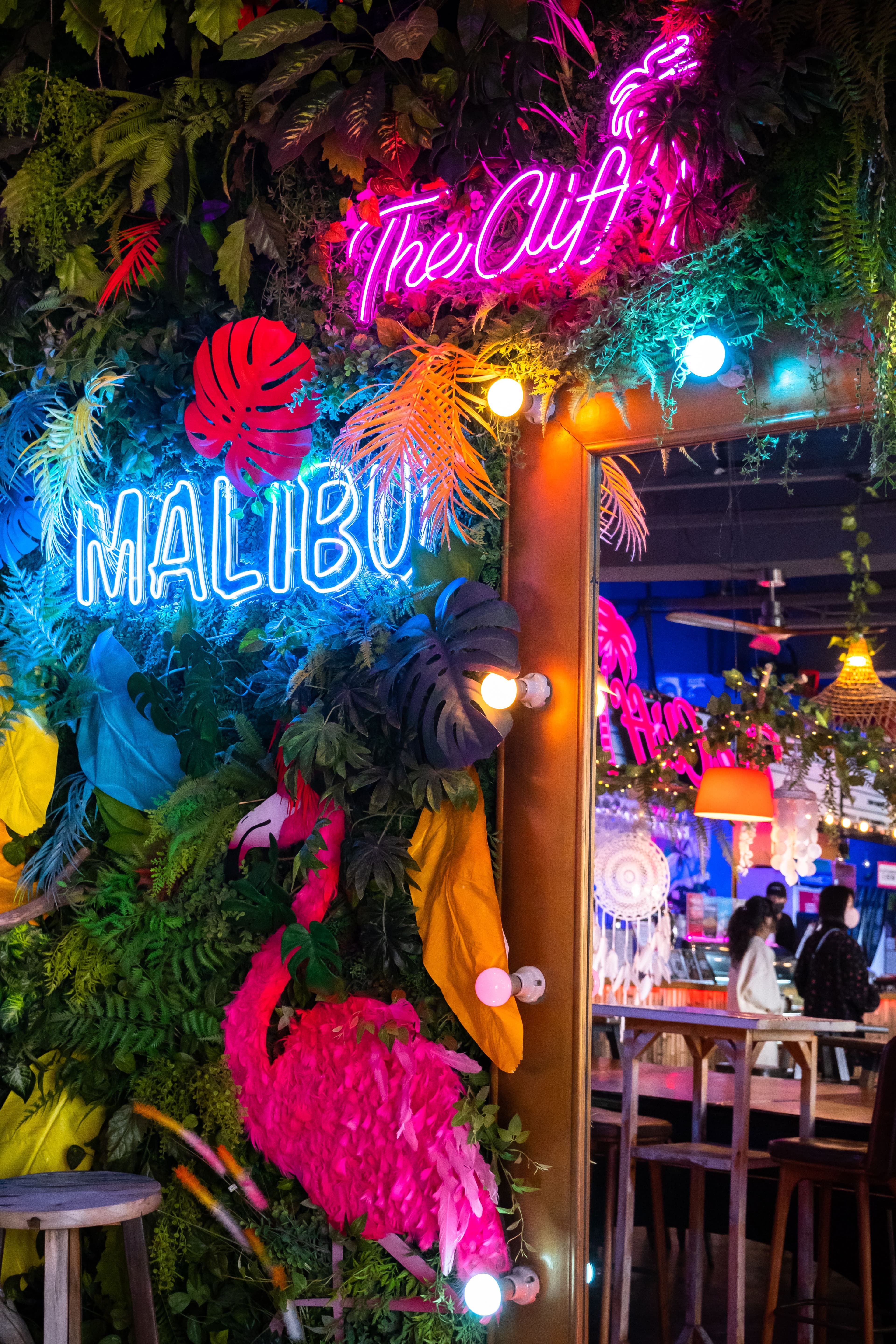 Representative nightlife photo with neon lights and tropical bar energy