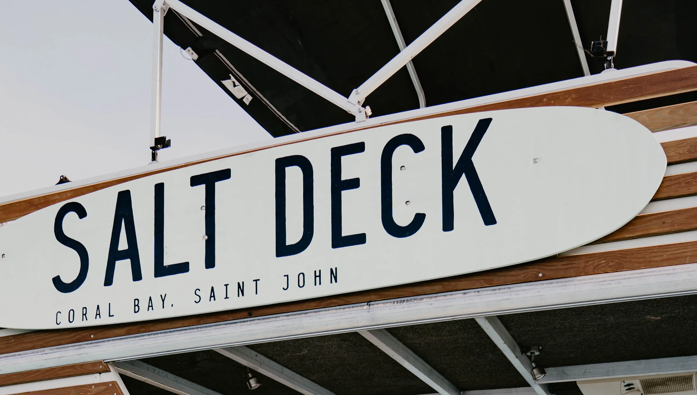 The Salt Deck sign and charter-vessel structure for Salty Daze Charters USVI in Coral Bay.